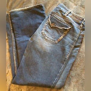 Silver woman’s bootcut jeans. Size unknown but 36 inch waist
